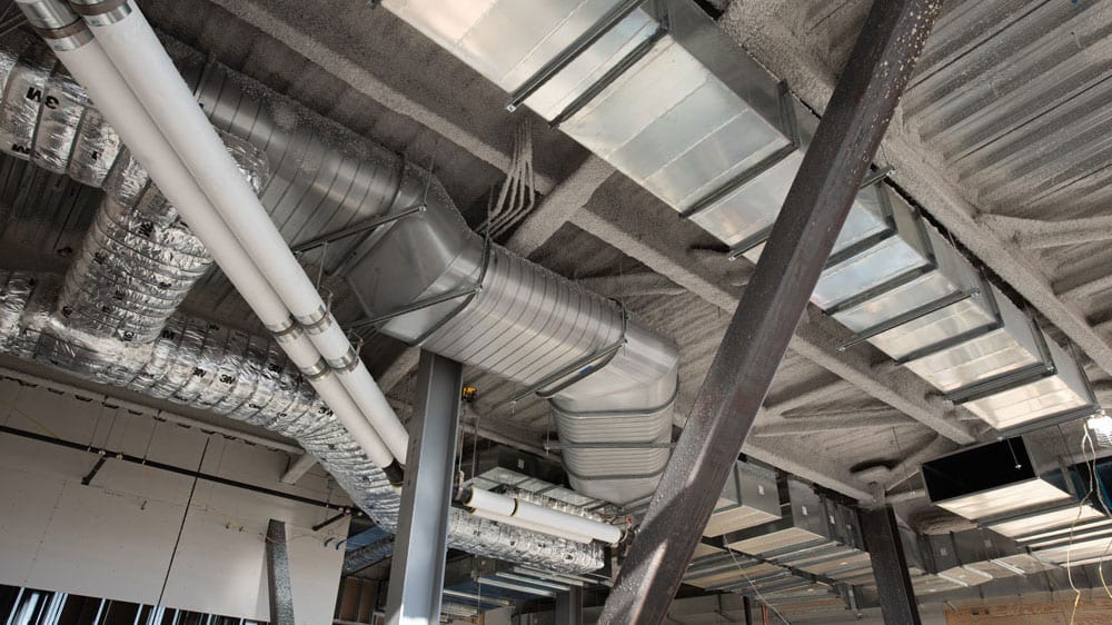 Metal ductwork installed in the ceiling of a building