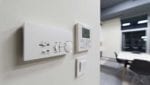 Programmable thermostat on a white wall