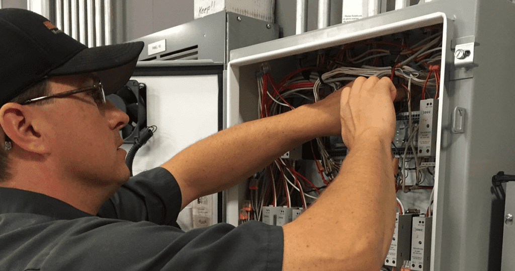HVAC Technician working on wires