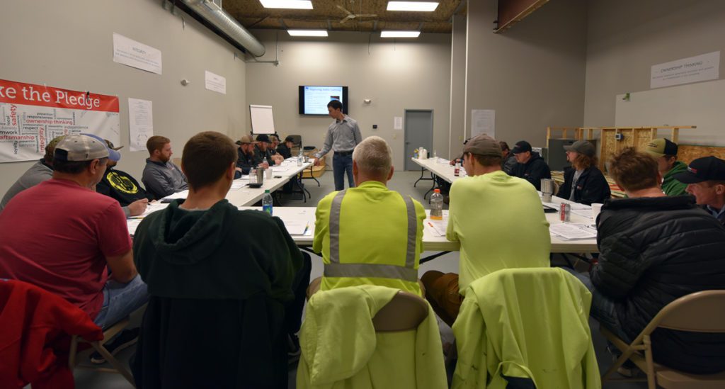 Custom Aire employees seated in class for continuing education